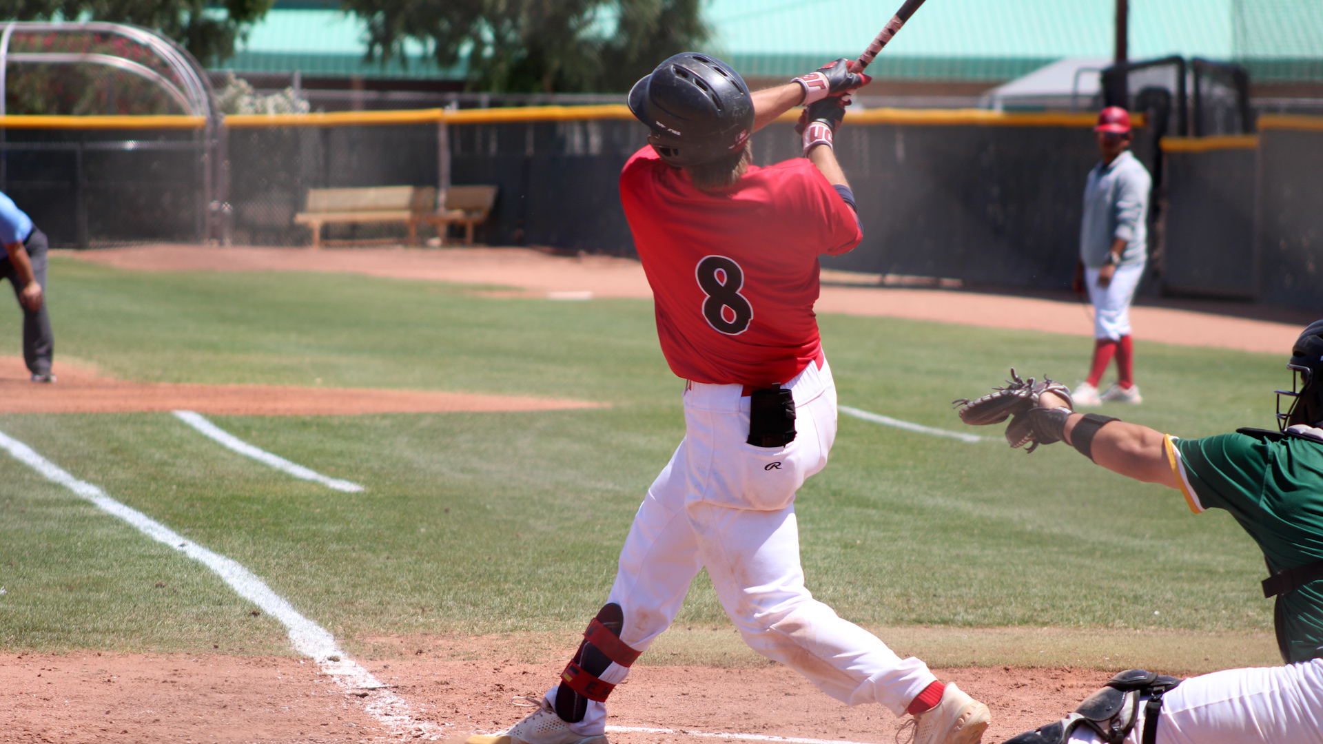 Elias Huber takes a big swing at home plate. Photo by Shayden Aguigui