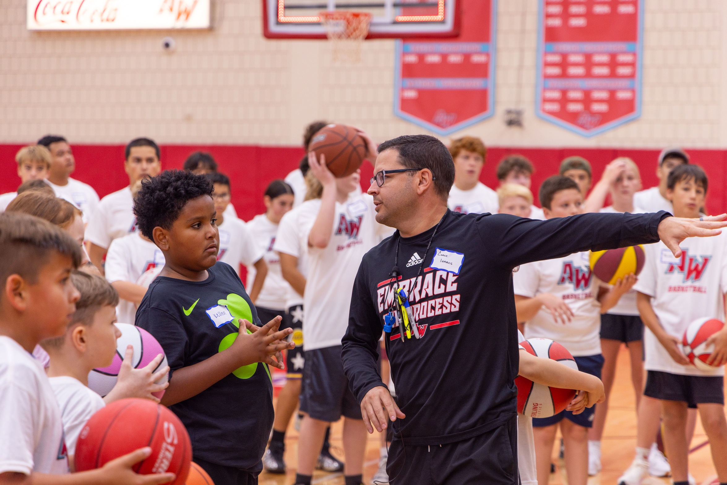 Arizona Western men's basketball coach Kyle Isaacs instructs students during 2025 summer basketball camp