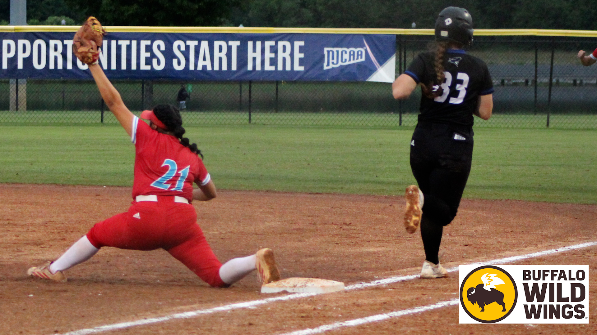 Analy Trejo stretches at first base to record an out versus Iowa Western. Photo by Ann Pitha